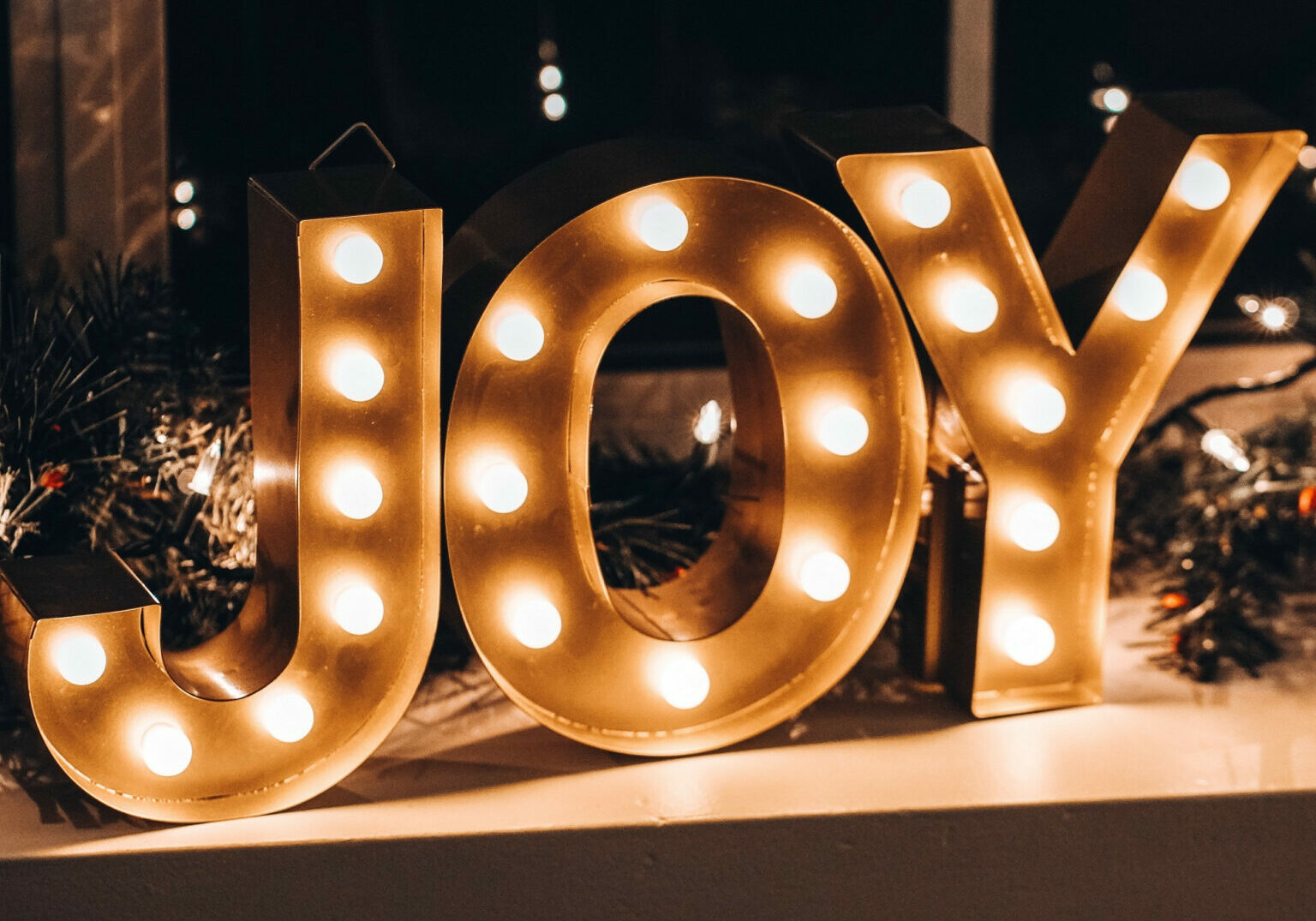 The word joy made up of fairy lights
